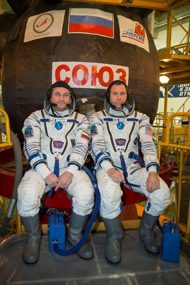 At the Baikonur Cosmodrome in Kazakhstan, the Expedition 55 backup crew members pose for pictures in front of the Soyuz MS-08 spacecraft March 5 as part of the crew’s first vehicle fit check activities. Alexey Ovchinin of Roscosmos (left) and Nick Hague of NASA (right) are serving as backups to the prime crew, Ricky Arnold and Drew Feustel of NASA and Oleg Artemyev of Roscosmos, who will launch March 21 in the Soyuz MS-08 spacecraft from Baikonur for a five-month mission on the International Space Station.
