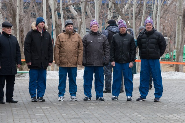 At their Cosmonaut Hotel crew quarters in Baikonur, Kazakhstan, the Expedition 55 prime and backup crewmembers attend a traditional flag raising ceremony March 6. From the second from the left are backup crewmembers Nick Hague of NASA and Alexey Ovchinin of Roscosmos and prime crewmembers Oleg Artemyev of Roscosmos and Drew Feustel and Ricky Arnold of NASA. Feustel, Arnold and Artemyev will launch March 21 on the Soyuz MS-08 spacecraft from the Baikonur Cosmodrome for a five-month mission on the International Space Station.