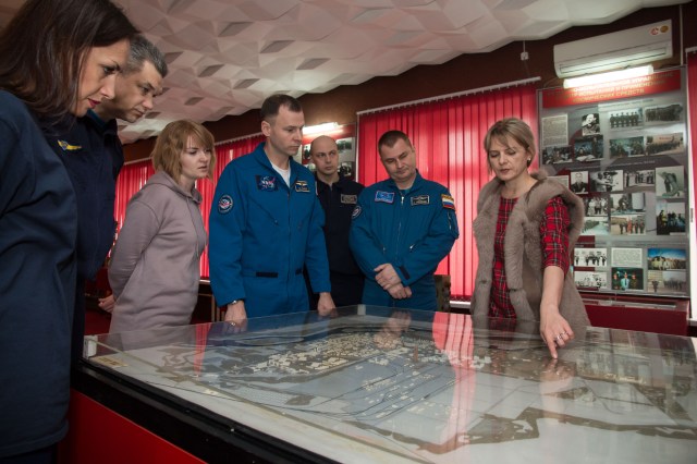 In the city of Baikonur, Kazakhstan, Expedition 55 backup crew members Nick Hague of NASA (fourth from left) and Alexey Ovchinin of Roscosmos receive a briefing on the layout of the Baikonur Cosmodrome March 6 during a traditional tour of the city’s museum. Prime crewmembers Drew Feustel and Ricky Arnold of NASA and Oleg Artemyev of Roscosmos will launch March 21 on the Soyuz MS-08 spacecraft from the Baikonur Cosmodrome for a five-month mission on the International Space Station.