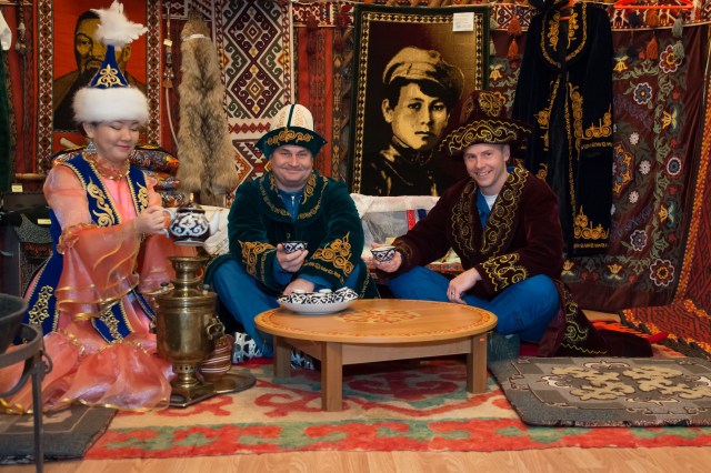 In the city of Baikonur, Kazakhstan, Expedition 55 backup crew members Alexey Ovchinin of Roscosmos (center) and Nick Hague of NASA (right) pose for pictures March 6 in a “yurt”, a traditional Kazakh dwelling, during a pre-launch tour of the city’s museum. Prime crewmembers Drew Feustel and Ricky Arnold of NASA and Oleg Artemyev of Roscosmos will launch March 21 on the Soyuz MS-08 spacecraft from the Baikonur Cosmodrome for a five-month mission on the International Space Station.