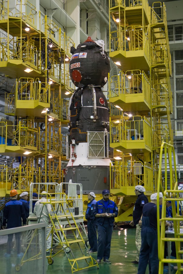 In the Integration Facility at the Baikonur Cosmodrome in Kazakhstan, the Soyuz MS-08 spacecraft awaits its rotation to a horizontal position March 14 to be encapsulated in the upper stage of a Soyuz booster rocket. Expedition 55 crewmembers Drew Feustel and Ricky Arnold of NASA and Oleg Artemyev of Roscosmos will launch in the Soyuz March 21 for a five-month mission on the International Space Station.