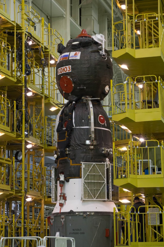 In the Integration Facility at the Baikonur Cosmodrome in Kazakhstan, the Soyuz MS-08 spacecraft awaits its rotation to a horizontal position March 14 to be encapsulated in the upper stage of a Soyuz booster rocket. Expedition 55 crewmembers Drew Feustel and Ricky Arnold of NASA and Oleg Artemyev of Roscosmos will launch in the Soyuz March 21 for a five-month mission on the International Space Station.