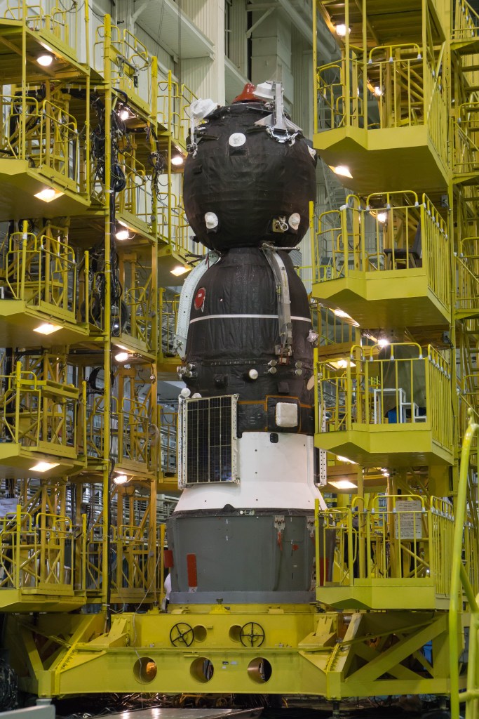 In the Integration Facility at the Baikonur Cosmodrome in Kazakhstan, the Soyuz MS-08 spacecraft awaits its rotation to a horizontal position March 14 to be encapsulated in the upper stage of a Soyuz booster rocket. Expedition 55 crewmembers Drew Feustel and Ricky Arnold of NASA and Oleg Artemyev of Roscosmos will launch in the Soyuz March 21 for a five-month mission on the International Space Station.
