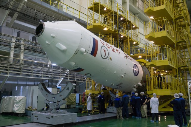 In the Integration Facility at the Baikonur Cosmodrome in Kazakhstan, the upper stage of a Soyuz booster rocket is raised to a vertical position March 14 after the Soyuz MS-08 spacecraft was encapsulated into the booster. Expedition 55 crewmembers Drew Feustel and Ricky Arnold of NASA and Oleg Artemyev of Roscosmos will launch in the Soyuz March 21 for a five-month mission on the International Space Station.