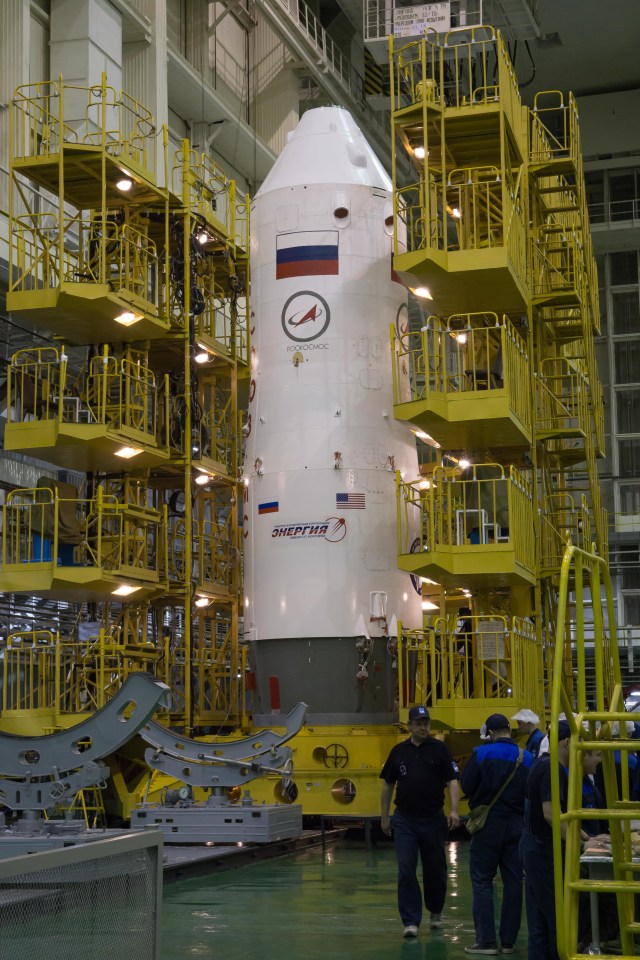 In the Integration Facility at the Baikonur Cosmodrome in Kazakhstan, the upper stage of a Soyuz booster rocket is seen in a vertical position March 14 for final testing after the Soyuz MS-08 spacecraft was encapsulated into the booster. Expedition 55 crewmembers Drew Feustel and Ricky Arnold of NASA and Oleg Artemyev of Roscosmos will launch in the Soyuz March 21 for a five-month mission on the International Space Station.