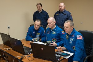 At the Cosmonaut Hotel crew quarters in Baikonur, Kazakhstan, Expedition 55 crew members Ricky Arnold of NASA (left), Oleg Artemyev of Roscosmos (center) and Drew Feustel of NASA (right) practice rendezvous techniques on a laptop computer simulator March 15 as part of their pre-launch activities. They will launch March 21 on the Soyuz MS-08 spacecraft from the Baikonur Cosmodrome on a five-month mission to the International Space Station.