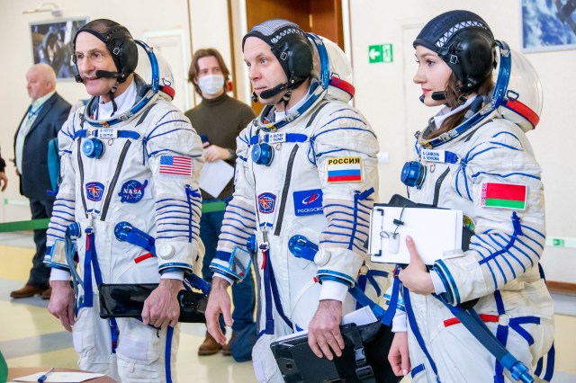 Soyuz MS-25 backup crew members (from left) Don Pettit from NASA, Ivan Vagner from Roscosmos, and Belarus spaceflight participant Anastasia Lenkova are pictured in their Sokol Launch and entry suits arriving for crew qualification exams at the Gagarin Cosmonaut Training Center in Star City, Russia.