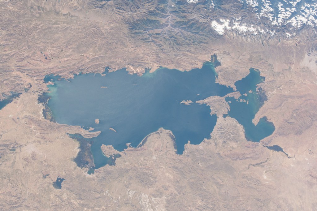Lake Titicaca is bisected by the South American countries of Peru and Bolivia with the Andes Mountain range skirting up against its northwestern edge.