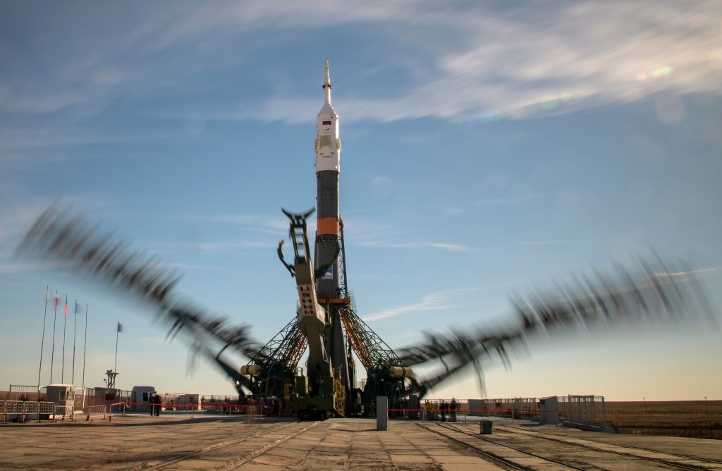 At the Baikonur Cosmodrome in Kazakhstan, launch pad gantry arms are seen closing around the Soyuz rocket in this long exposure photograph, Tuesday, Oct. 9, 2018. Expedition 57 crewmembers Nick Hague of NASA and Alexey Ovchinin of Roscosmos are scheduled to launch on October 11 on the Soyuz MS-10 spacecraft for a six-month mission living and working aboard the International Space Station.
