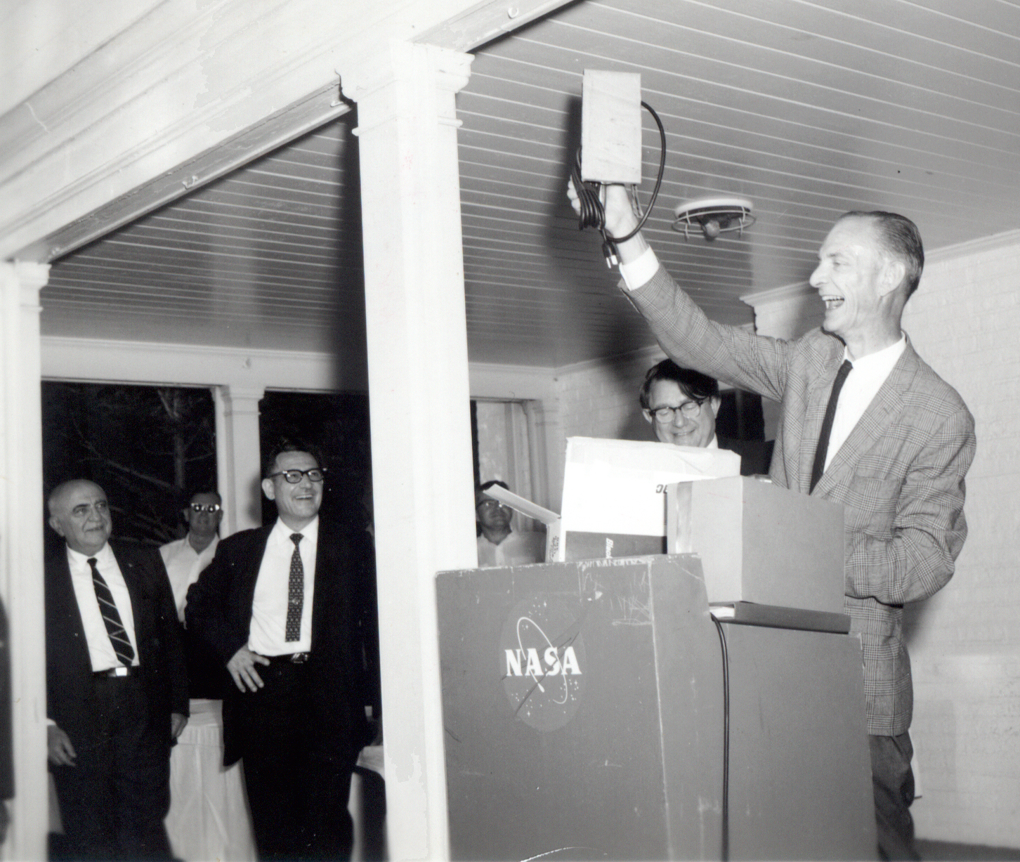 Man holding up gift.