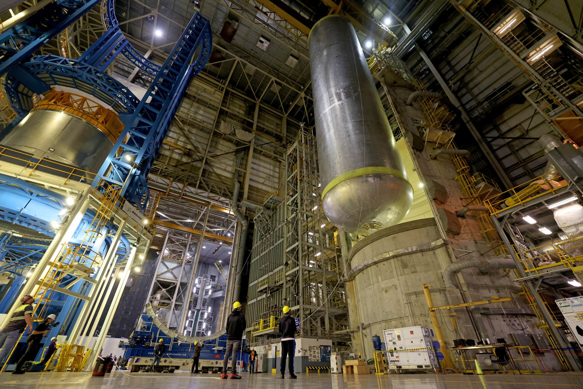 All the major structures that will form the core stage for NASA's SLS (Space Launch System) rocket for the agency's Artemis III mission are structurally complete. Technicians finished welding the 51-foot liquid oxygen tank structure, left, inside the Vertical Assembly Building at NASA's Michoud Assembly Facility in New Orleans Jan. 8. The liquid hydrogen tank, right, completed internal cleaning Nov. 14.