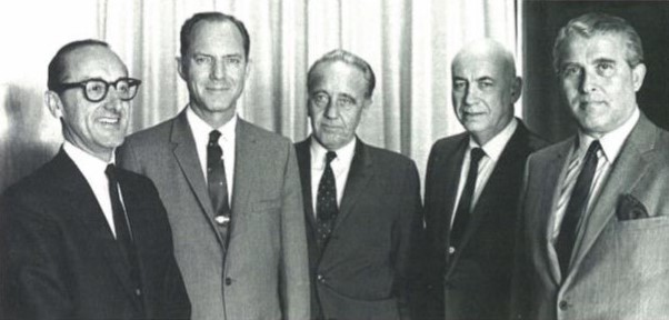 Senior NASA management assembled for the Apollo 9 Flight Readiness Review at NASA's Kennedy Space Center (KSC): Associate Administrator for Manned Flight George E. Mueller, left, Apollo Program Director Samuel C. Phillips, KSC Director Kurt H. Debus, MSC Director Robert R. Gilruth, and Marshall Space Flight Center Director Wernher von Braun