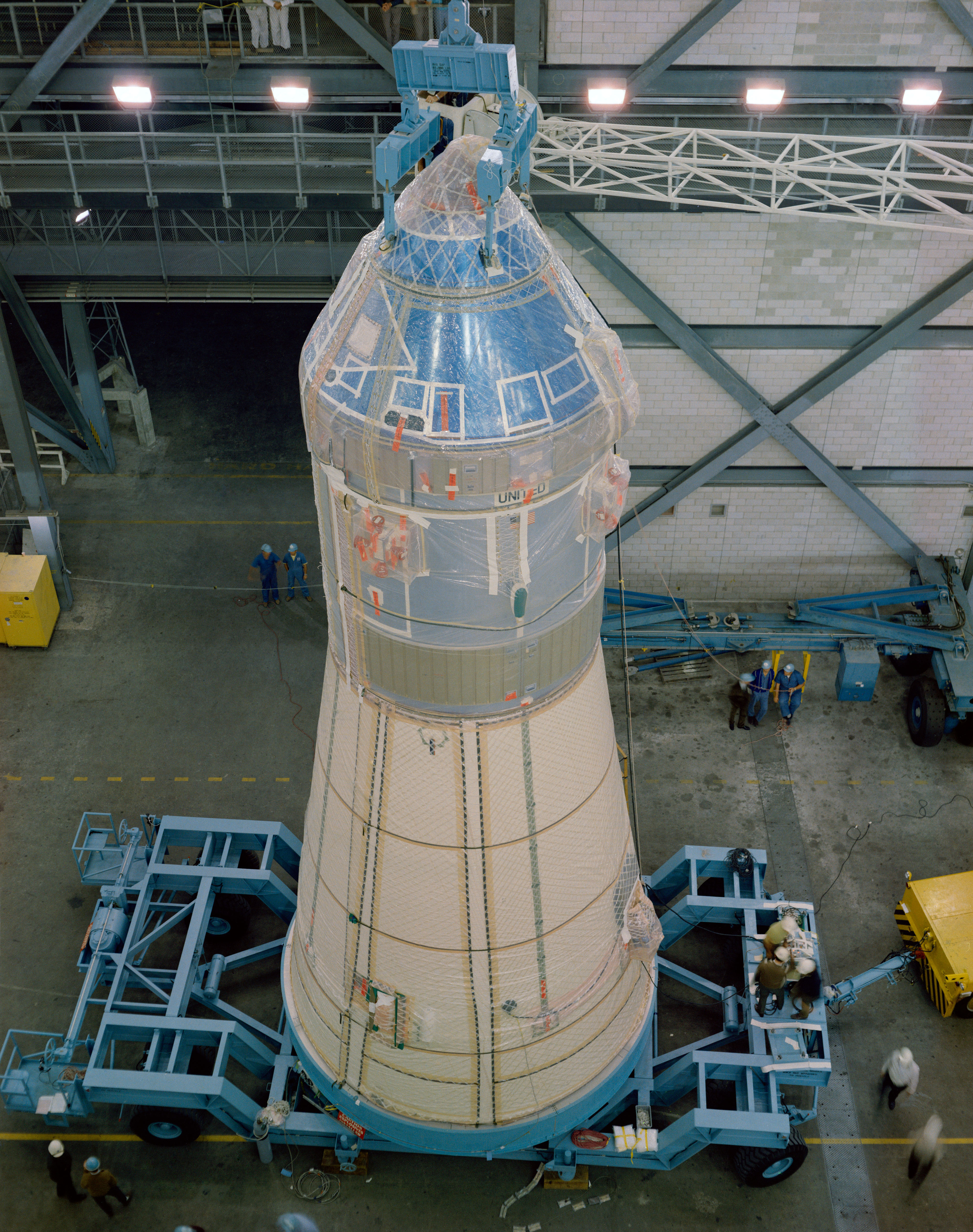 The Apollo 10 spacecraft, the Command and Service Modules and the Lunar Module (LM) encased in the Spacecraft LM Adapter, arrives from the Manned Spacecraft Operations Building