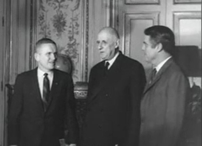 Borman, left, meets with French President Charles de Gaulle and U.S. Ambassador to France R. Sargent Shriver during the Paris stop of the tour