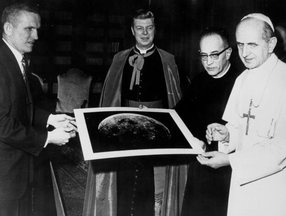 At The Vatican, Borman, left, presents a photograph of the Moon from Apollo 8 to Pope Paul VI