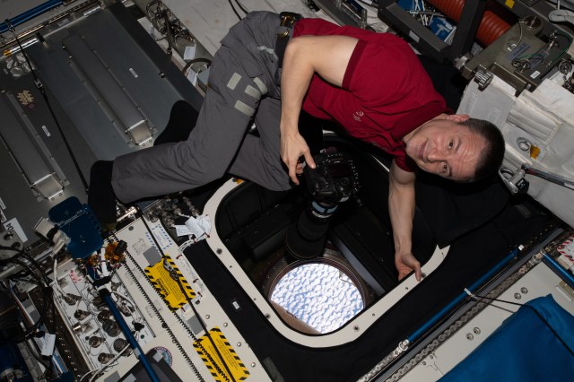 iss062e081076 (March 5, 2020) --- NASA astronaut and Expedition 62 Flight Engineer Andrew Morgan takes photographs of the Earth from the Window Observation Research Facility inside NASA's Destiny laboratory module.