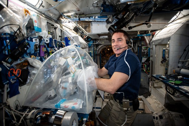 iss062e151904 (April 16, 2020) --- NASA astronaut Chris Cassidy services biological samples in a glovebag aboard the International Space Station for the Food Physiology experiment to characterize the key effects of an enhanced spaceflight diet on immune function, the gut microbiome, and nutritional status indicators.