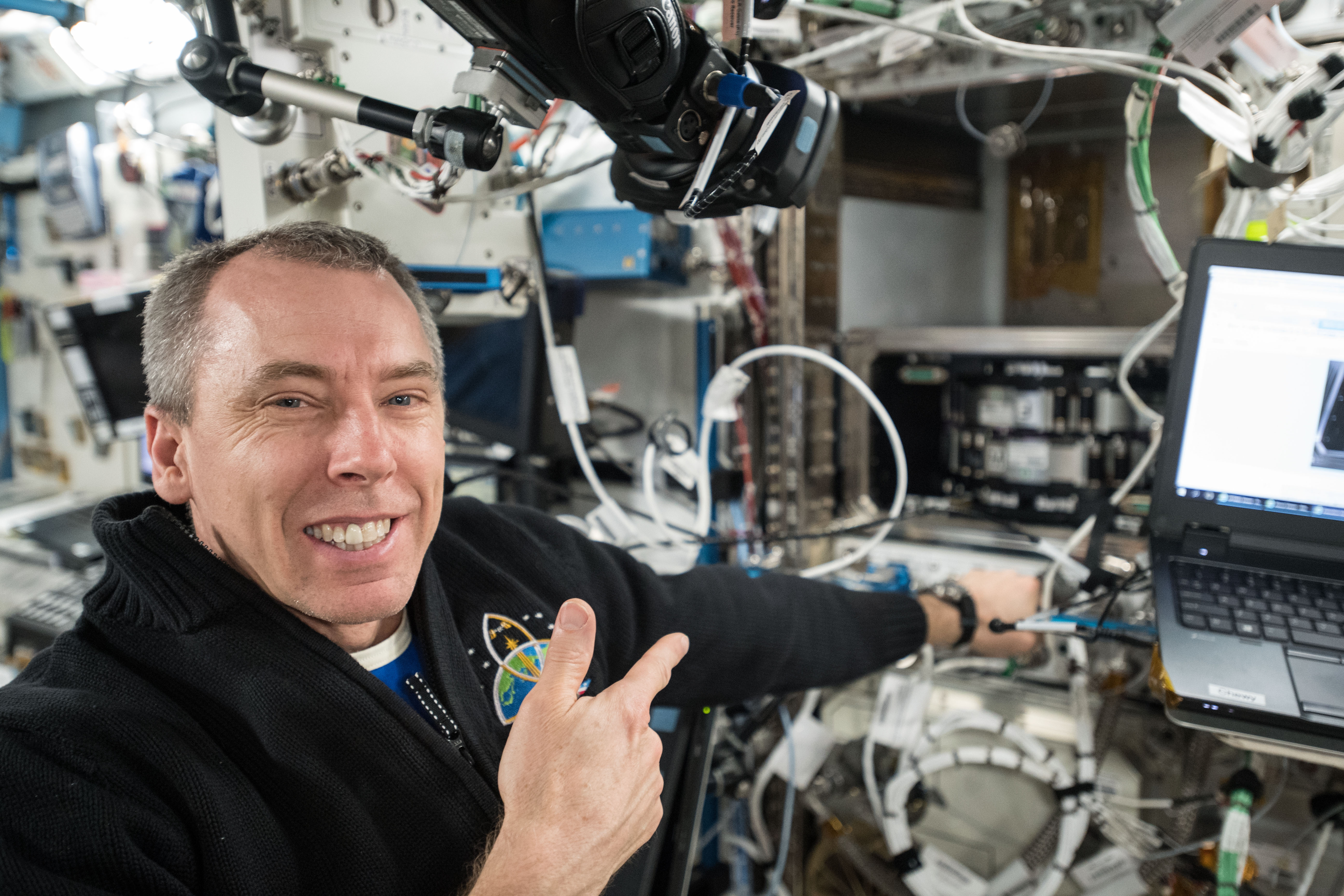 NASA astronaut Drew Feustel conducts science operations using the Multi-Use Variable-G Platform that enables research into smaller and microscopic organisms.
