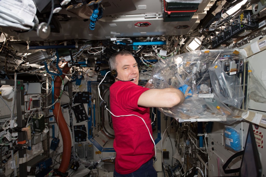 NASA astronaut Drew Feustel conducts science operations inside the Multi-use Variable-g Platform Module which enables research into how small organisms such as fruit flies, flatworms, plants, fish, cells, protein crystals and many others adapt to different types of gravity scenarios.