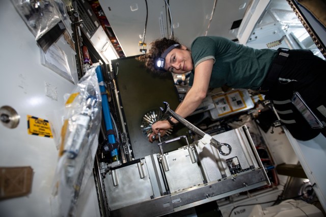 iss062e103552 (March 20, 2020) --- NASA astronaut and Expedition 62 Flight Engineer Jessica Meir works on the Major Constituent Analyzer, a device that measures the orbiting lab’s atmosphere. The life support gear monitors a variety of major constituents, such as nitrogen, carbon dioxide and water vapor to ensure a safe breathing environment for the crew.