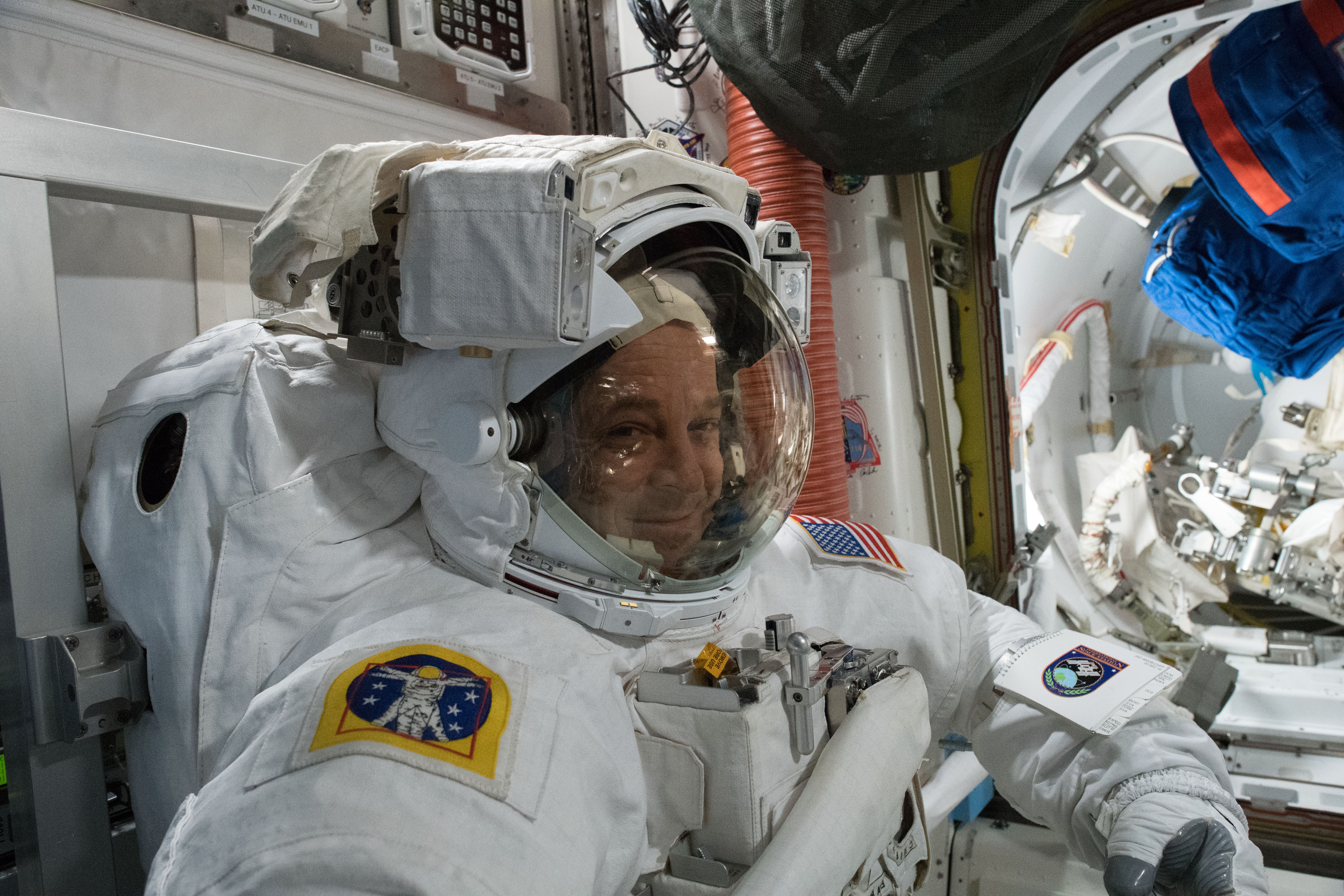 NASA astronaut Ricky Arnold is pictured inside a U.S. spacesuit for a fit check verification ahead of a pair of spacewalks.