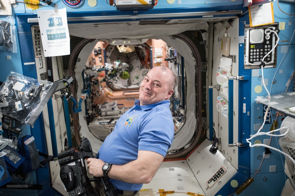 NASA astronaut Scott Tingle prepares video equipment for a series of education videos being recorded for the STEMonstration campaign which demonstrates scientific concepts in space for students and teachers.