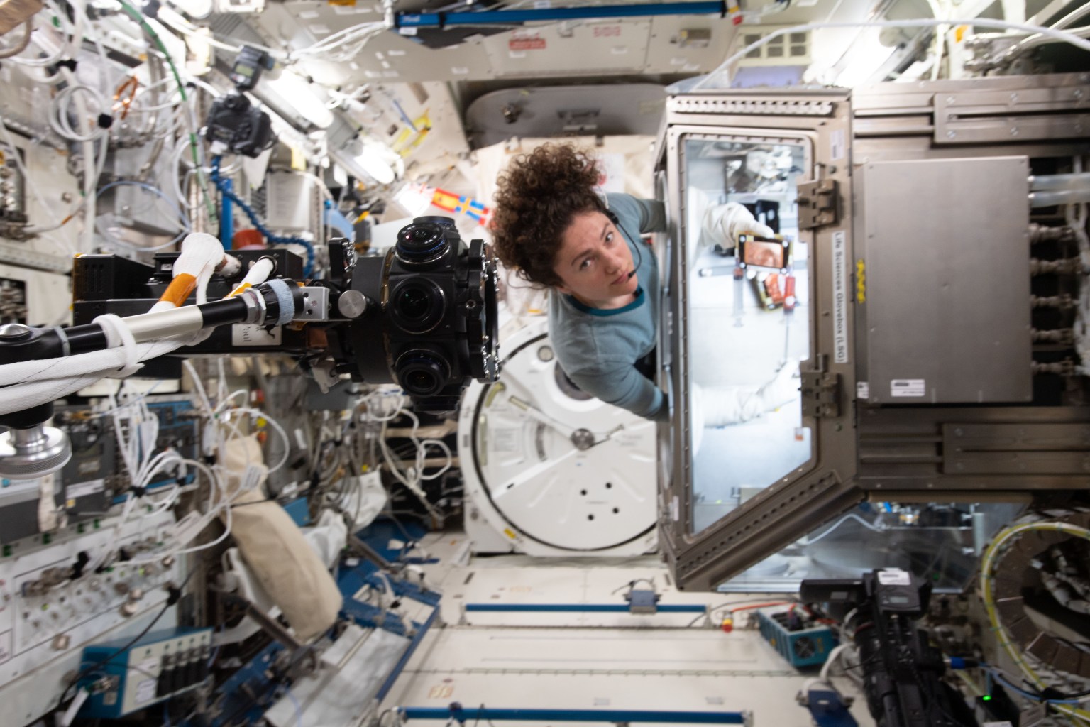 iss062e075187 (March 3, 2020) --- NASA astronaut and Expedition 62 Flight Engineer Jessica Meir swaps media that nourishes bone samples inside the Life Science Glovebox located in JAXA's (Japan Aerospace Exploration Agency) Kibo laboratory module. The experiment compares the microgravity-exposed samples to magnetically levitated samples on Earth for insights into bone ailments such as osteoporosis.