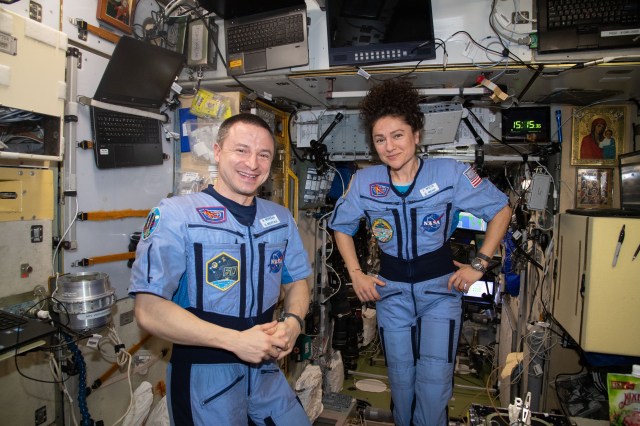 iss062e133028 (March 29, 2020) --- NASA astronauts and Expedition 62 Flight Engineers Andrew Morgan and Jessica Meir pose for a portrait inside the International Space Station's Zvezda service module.