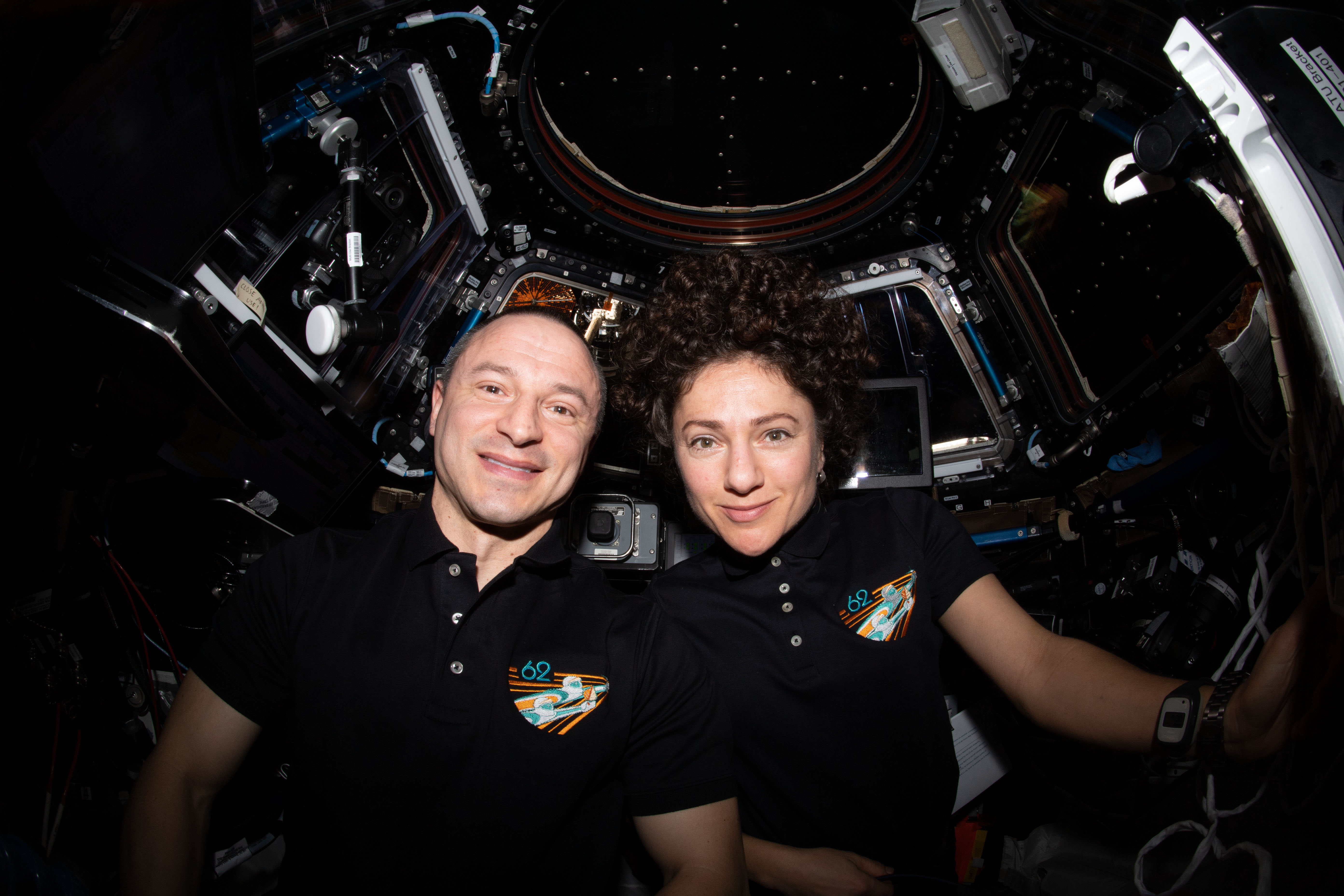 iss062e024073 (Feb. 18, 2020) --- NASA astronauts Andrew Morgan and Jessica Meir pose for a portrait inside the cupola, the International Space Station's "window to the world." The two Expedition 62 Flight Engineers were participating in the capture activities of Northrop Grumman's Cygnus cargo craft.