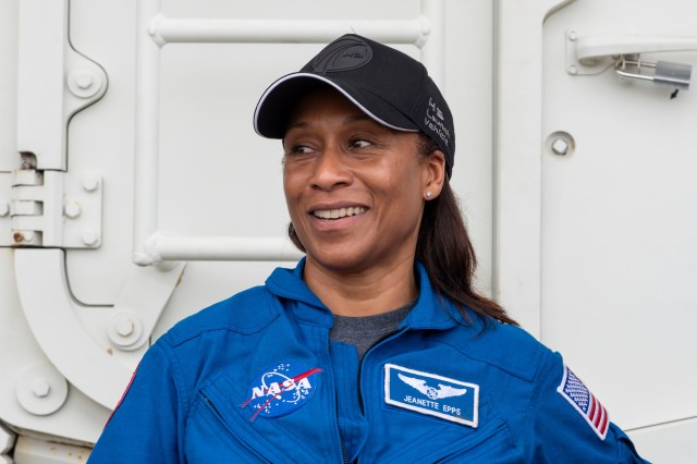 NASA's SpaceX Crew-8 Mission Specialist Jeanette Epps poses for a photo outside the emergency egress vehicle at NASA's Kennedy Space Center's Launch Pad 39A in Florida. Astronauts would use the emergency egress vehicle to quickly leave the launch area in the unlikely event of an emergency.