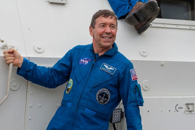 NASA's SpaceX Crew-8 Pilot Michael Barratt poses for a photo outside the emergency egress vehicle at NASA's Kennedy Space Center's Launch Pad 39A in Florida. Astronauts would use the emergency egress vehicle to quickly leave the launch area in the unlikely event of an emergency.