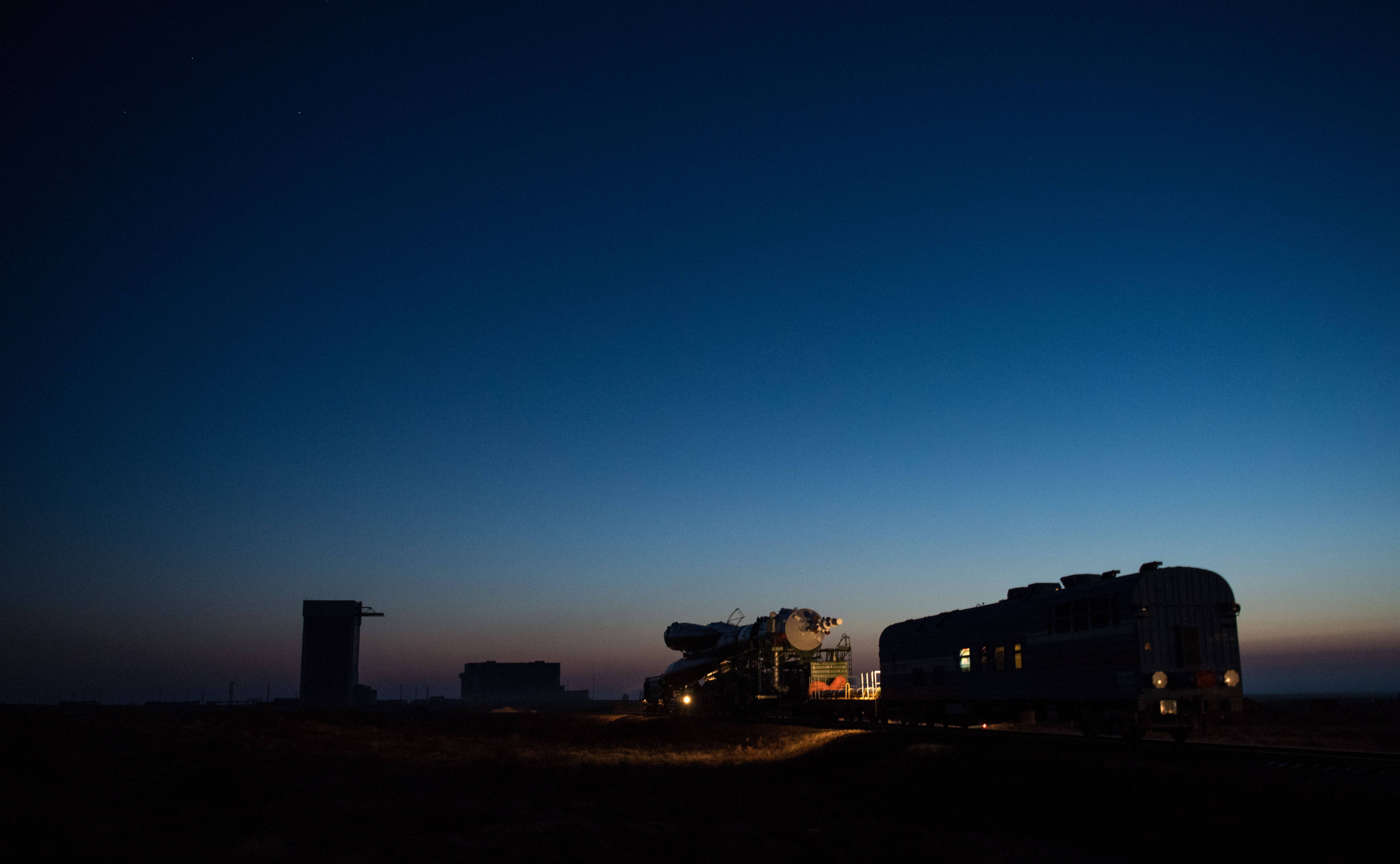 The Soyuz rocket is rolled out by train to the launch pad, Monday, March 19, 2018 at the Baikonur Cosmodrome in Kazakhstan. Expedition 55 crewmembers Ricky Arnold and Drew Feustel of NASA and Oleg Artemyev of Roscosmos are scheduled to launch at 1:44 p.m. Eastern time (11:44 p.m. Baikonur time) on March 21 and will spend the next five months living and working aboard the International Space Station.