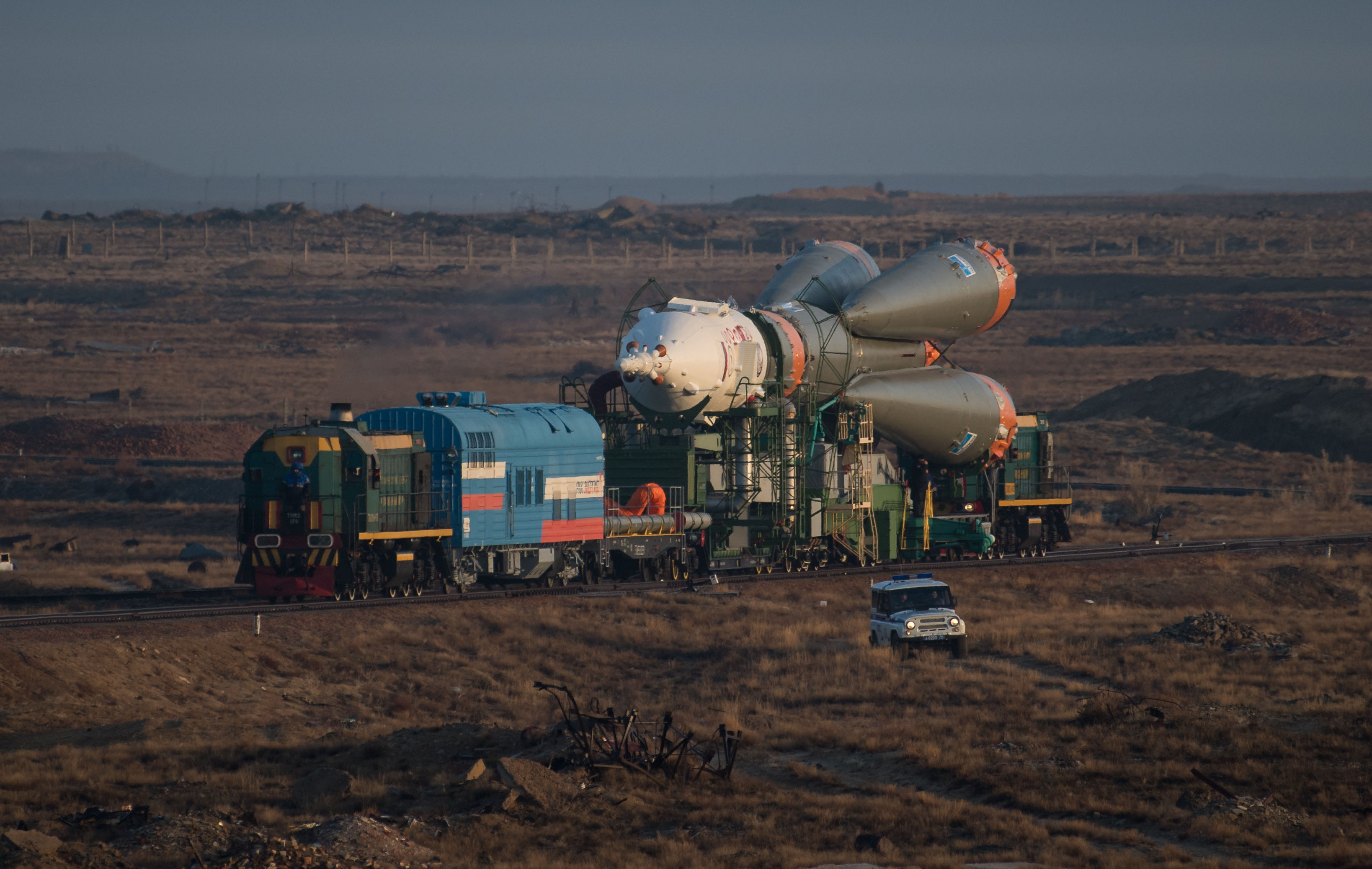 The Soyuz rocket is rolled out by train to the launch pad, Monday, March 19, 2018 at the Baikonur Cosmodrome in Kazakhstan. Expedition 55 crewmembers Ricky Arnold and Drew Feustel of NASA and Oleg Artemyev of Roscosmos are scheduled to launch at 1:44 p.m. Eastern time (11:44 p.m. Baikonur time) on March 21 and will spend the next five months living and working aboard the International Space Station.