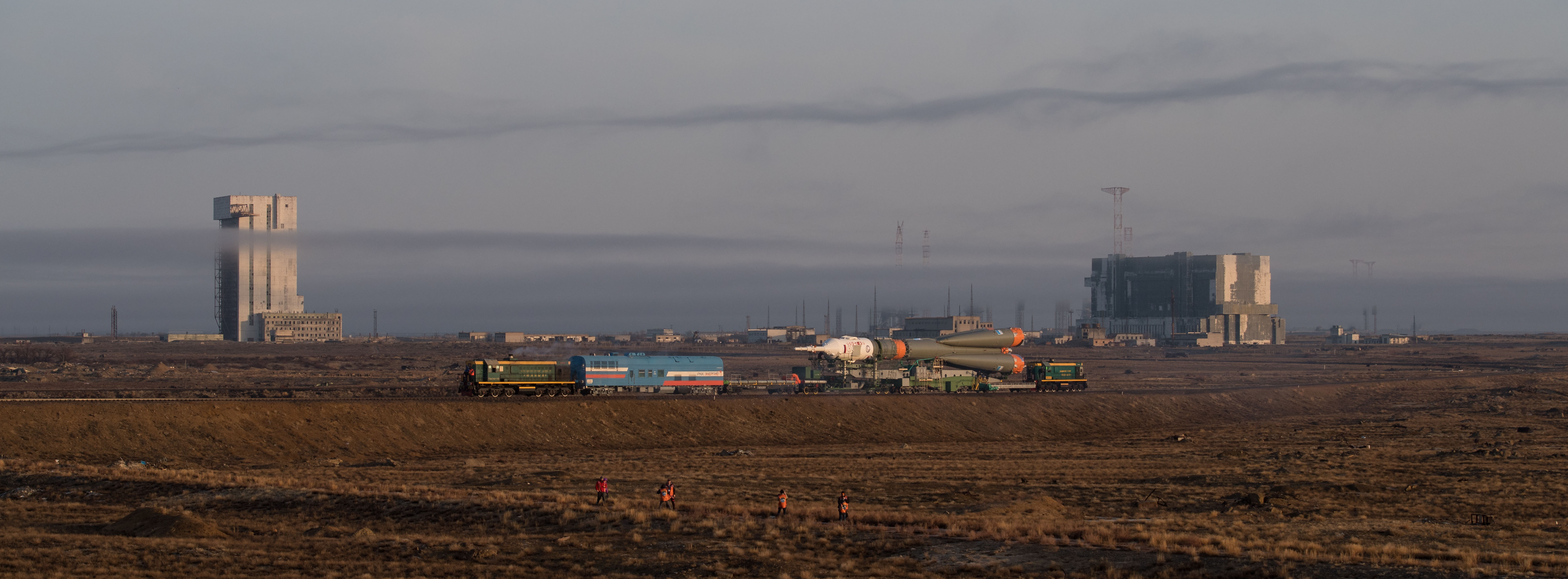 The Soyuz rocket is rolled out by train to the launch pad, Monday, March 19, 2018 at the Baikonur Cosmodrome in Kazakhstan. Expedition 55 crewmembers Ricky Arnold and Drew Feustel of NASA and Oleg Artemyev of Roscosmos are scheduled to launch at 1:44 p.m. Eastern time (11:44 p.m. Baikonur time) on March 21 and will spend the next five months living and working aboard the International Space Station.