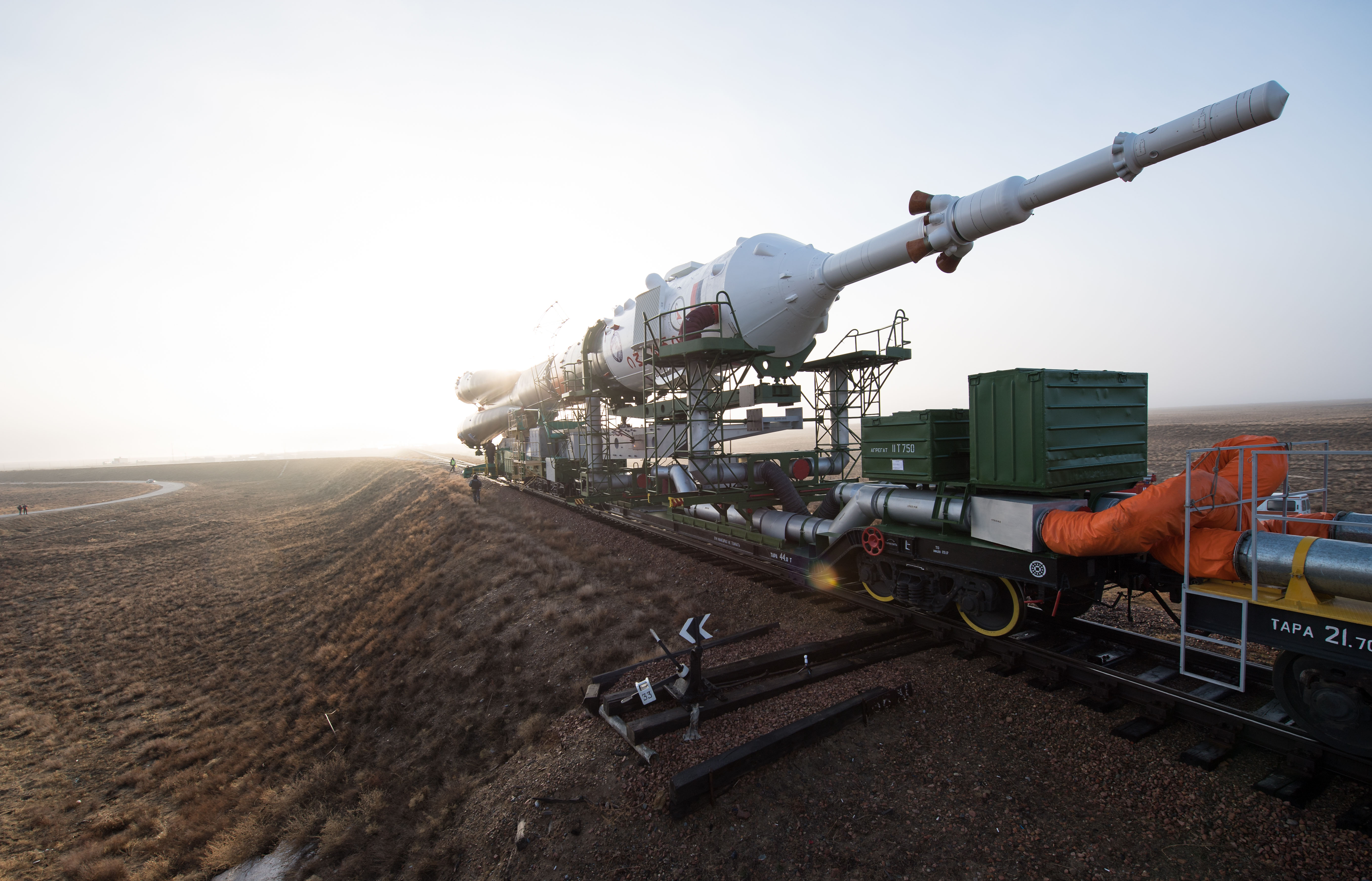 The Soyuz rocket is rolled out by train to the launch pad, Monday, March 19, 2018 at the Baikonur Cosmodrome in Kazakhstan. Expedition 55 crewmembers Ricky Arnold and Drew Feustel of NASA and Oleg Artemyev of Roscosmos are scheduled to launch at 1:44 p.m. Eastern time (11:44 p.m. Baikonur time) on March 21 and will spend the next five months living and working aboard the International Space Station.