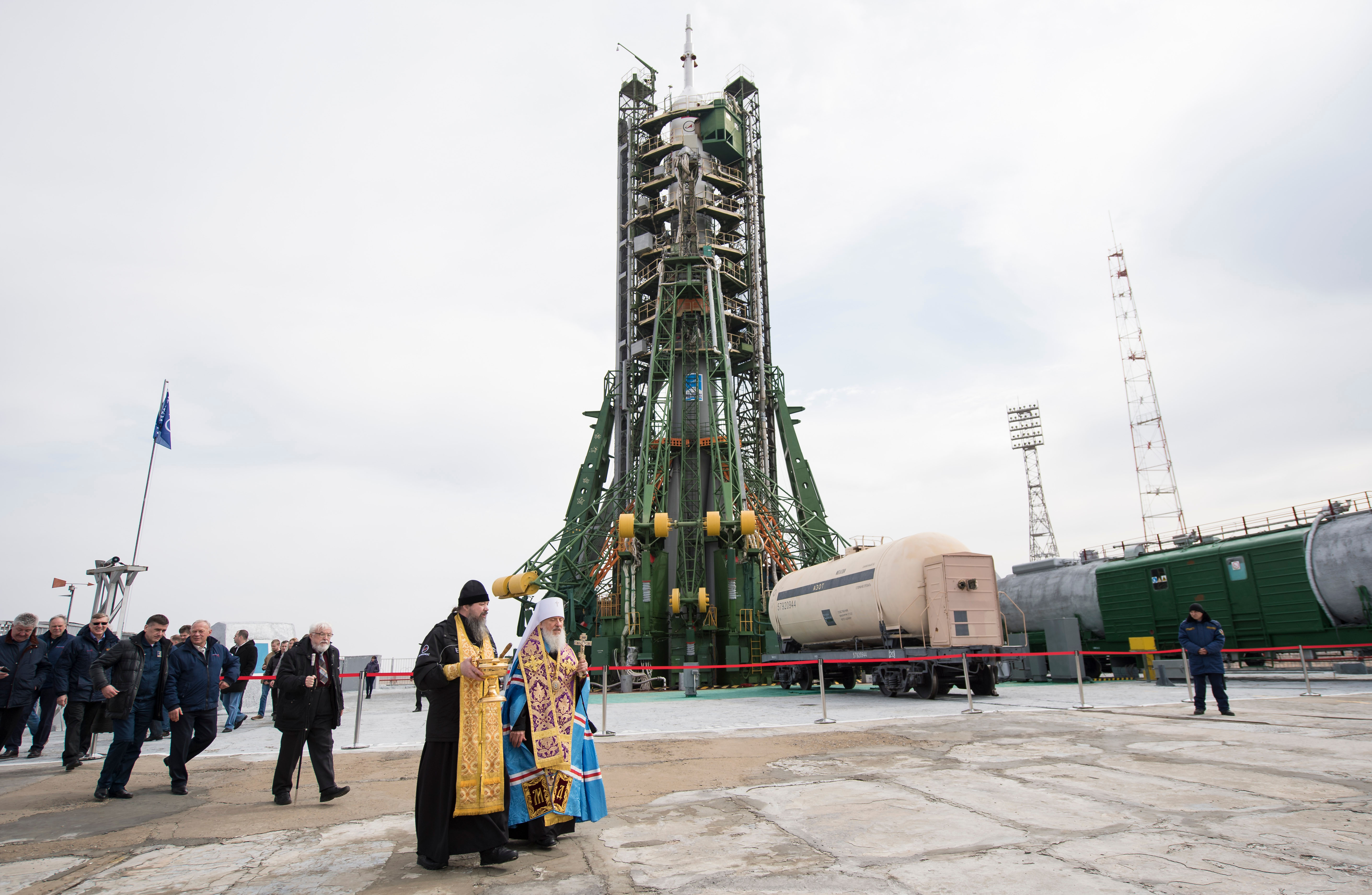 A pair of Orthodox Priests are seen after blessing the Soyuz rocket at the Baikonur Cosmodrome launch pad, Tuesday, March 20, 2018 in Baikonur, Kazakhstan. Expedition 55 Soyuz Commander Oleg Artemyev of Roscosmos, Ricky Arnold and Drew Feustel of NASA are scheduled to launch to the International Space Station aboard the Soyuz MS-08 spacecraft on Wednesday, March, 21.