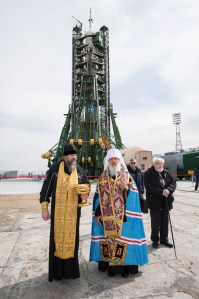 An Orthodox Priest blesses members of the media at the Baikonur Cosmodrome launch pad, Tuesday, March 20, 2018 in Baikonur, Kazakhstan. Expedition 55 Soyuz Commander Oleg Artemyev of Roscosmos, Ricky Arnold and Drew Feustel of NASA are scheduled to launch to the International Space Station aboard the Soyuz MS-08 spacecraft on Wednesday, March, 21.