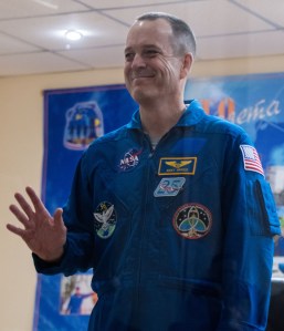 Expedition 55 flight engineer Ricky Arnold is seen in quarantine, behind glass, during a press conference, Tuesday, March 20, 2018 a the Cosmonaut Hotel in Baikonur, Kazakhstan. Arnold and his fellow Expedition 55 crew members Oleg Artemyev of Roscosmos and flight engineer Drew Feustal of NASA are scheduled to launch to the International Space Station aboard the Soyuz MS-08 spacecraft on Wednesday, March 21.