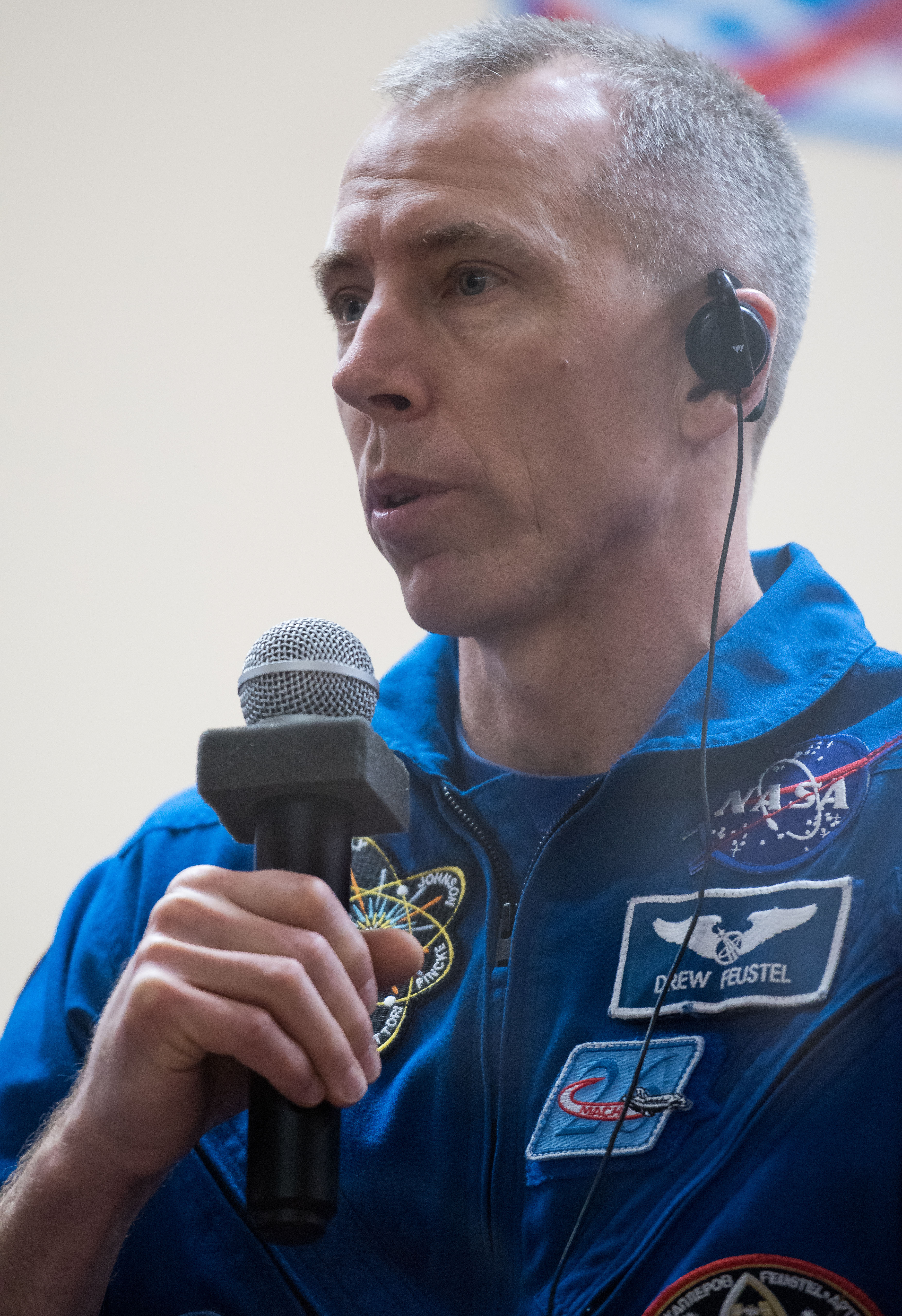 Expedition 55 flight engineer Drew Feustal of NASA answers a question during a press conference, Tuesday, March 20, 2018 a the Cosmonaut Hotel in Baikonur, Kazakhstan. Feustal, Soyuz Commander Oleg Artemyev of Roscosmos, and flight engineer Ricky Arnold of NASA are scheduled to launch to the International Space Station aboard the Soyuz MS-08 spacecraft on Wednesday, March 21.