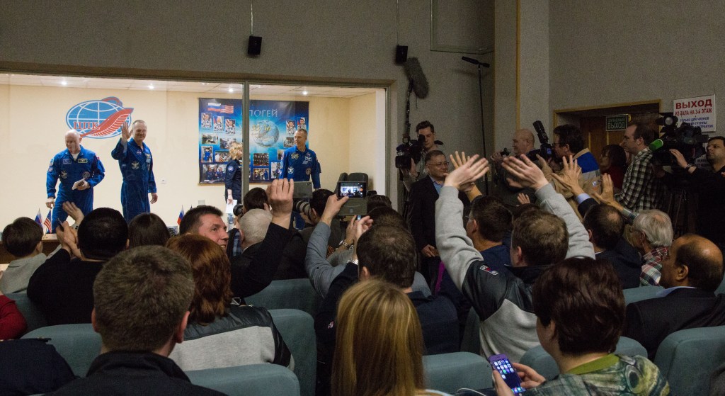 Expedition 55 flight engineer Ricky Arnold of NASA, left, Soyuz Commander Oleg Artemyev of Roscosmos, center, and flight engineer Drew Feustal of NASA, right, are seen at the conclusion of a press conference, Tuesday, March 20, 2018 a the Cosmonaut Hotel in Baikonur, Kazakhstan. Arnold, Artemyev, and Feustal are scheduled to launch to the International Space Station aboard the Soyuz MS-08 spacecraft on Wednesday, March 21.