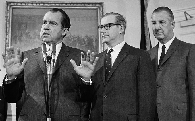 President Nixon, left, and Vice President Spiro T. Agnew, right, introduce Thomas O. Paine as the nominee to be NASA administrator on March 5, 1969