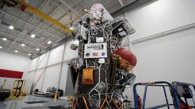 The Nova-C lunar lander is seen in the high bay of Intuitive Machines Headquarters in Houston, before it shipped to NASA’s Kennedy Space Center in Florida for integration with a SpaceX Falcon 9 rocket for launch as part of NASA’s CLPS (Commercial Lunar Payload Services) initiative and Artemis campaign.