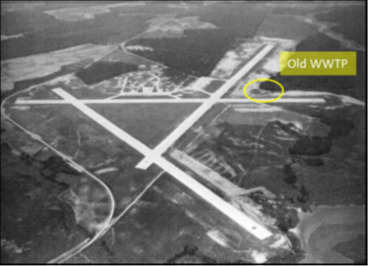 Old black-and-white aerial photo of Wallops Main Base with Old WWTP site circled, near the intersection of two aircraft runways.