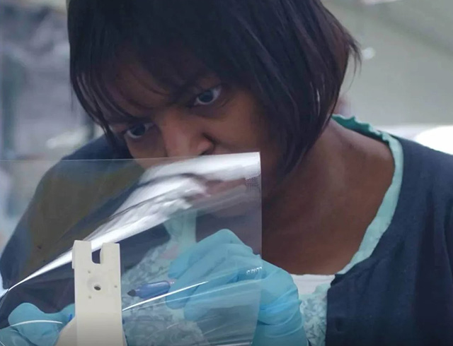 NASA thermal blanket technician Paula Cain at work