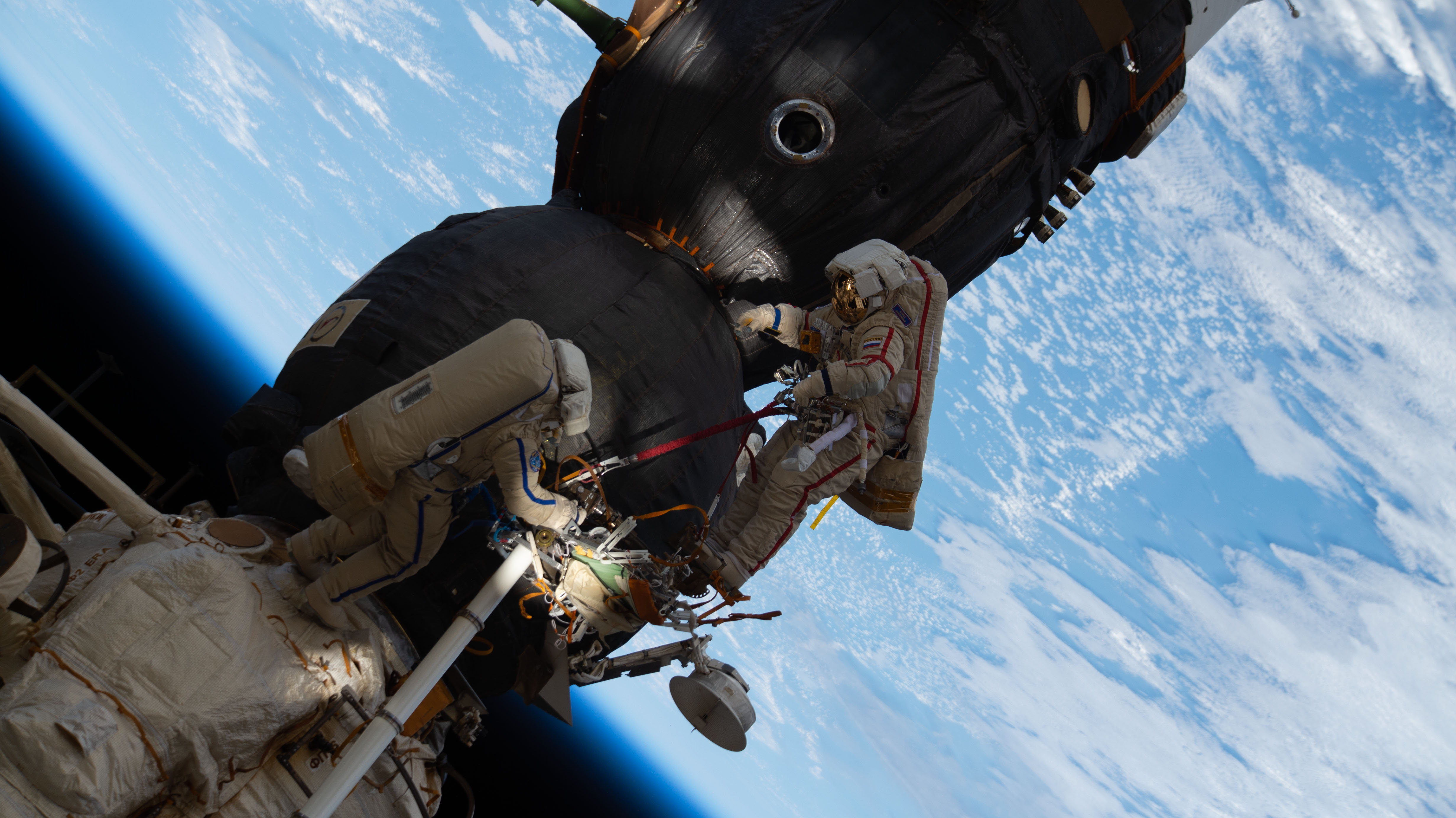 Russian spacewalkers Oleg Kononenko (suit with red stripes) and Sergey Prokopyev (suit with blue stripes) work outside the International Space Station over 250 miles above Earth to inspect the Soyuz MS-09 spacecraft. During the spacewalk, the duo examined the external hull of the Soyuz crew ship docked to the Rassvet module. The area corresponded with the location of a small hole inside the Soyuz habitation module that was found in August and caused a decrease in the space station’s pressure. The hole was fixed internally with a sealant within hours of its detection. During the spacewalk, Kononenko and Prokopyev collected samples of some of the sealant that extruded through hole to the outer hull before heading back inside the Pirs docking compartment and closing the hatch completing a seven-hour, 45-minute spacewalk.