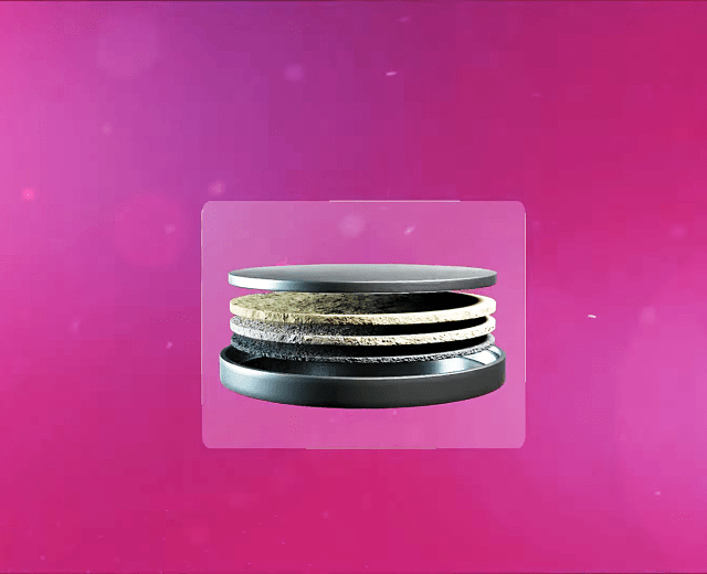Five metallic-looking discs that make up the parts of a future battery design are shown in an image captured from a video.