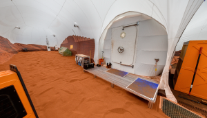 Crew members conduct simulated EVAs, or "Marswalks," inside the 1,200-square-foot andbox, which is filled with red sand to mimic the Martian landscape. Credit: NASA/Bill Stafford