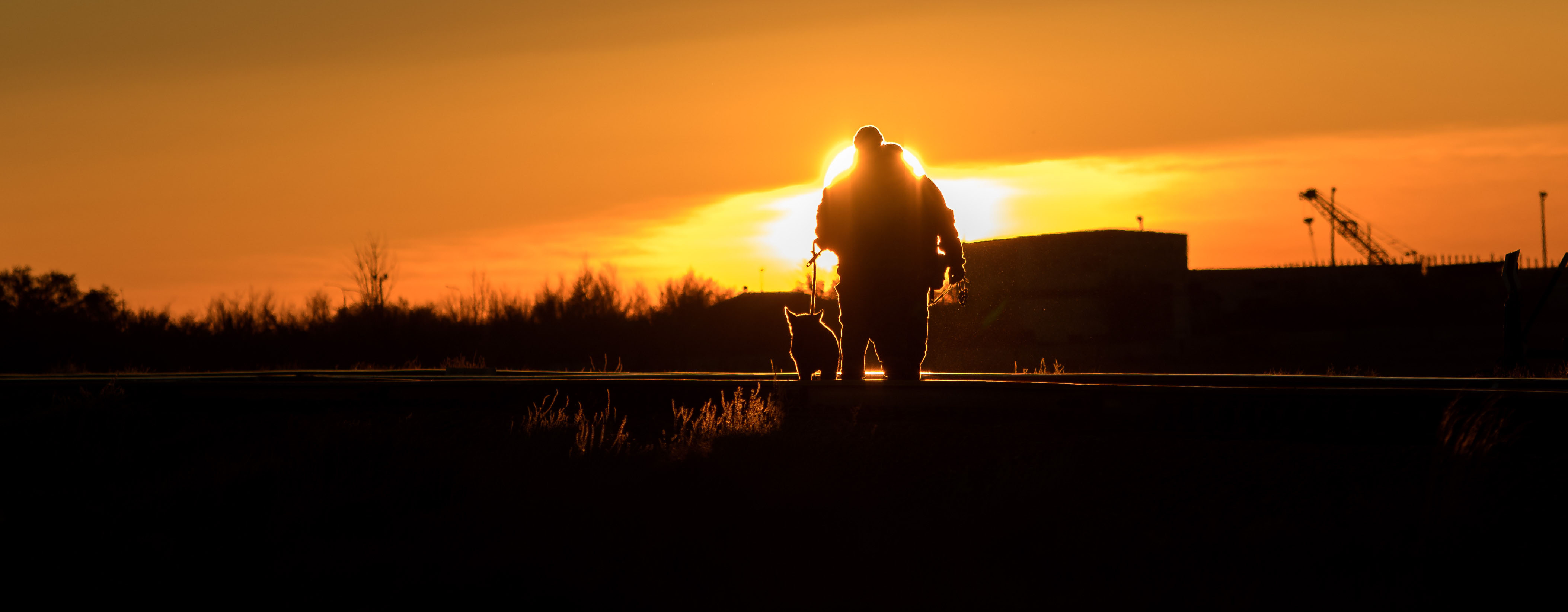 Security personnel and their dog sweep the train tracks in advance of the Soyuz rocket being rolled out to the launch pad, Tuesday, Oct. 9, 2018 at the Baikonur Cosmodrome in Kazakhstan. Expedition 57 crewmembers Nick Hague of NASA and Alexey Ovchinin of Roscosmos are scheduled to launch on October 11 and will spend the next six months living and working aboard the International Space Station.