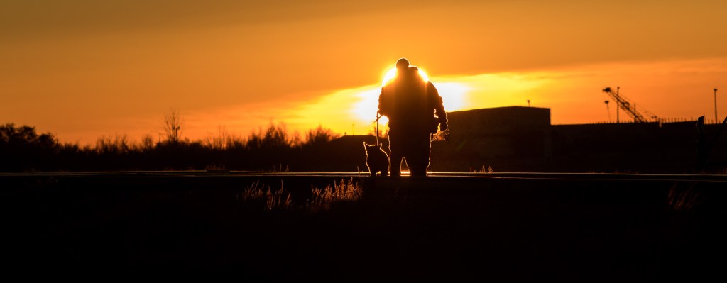 Security personnel and their dog sweep the train tracks in advance of the Soyuz rocket being rolled out to the launch pad, Tuesday, Oct. 9, 2018 at the Baikonur Cosmodrome in Kazakhstan. Expedition 57 crewmembers Nick Hague of NASA and Alexey Ovchinin of Roscosmos are scheduled to launch on October 11 and will spend the next six months living and working aboard the International Space Station.
