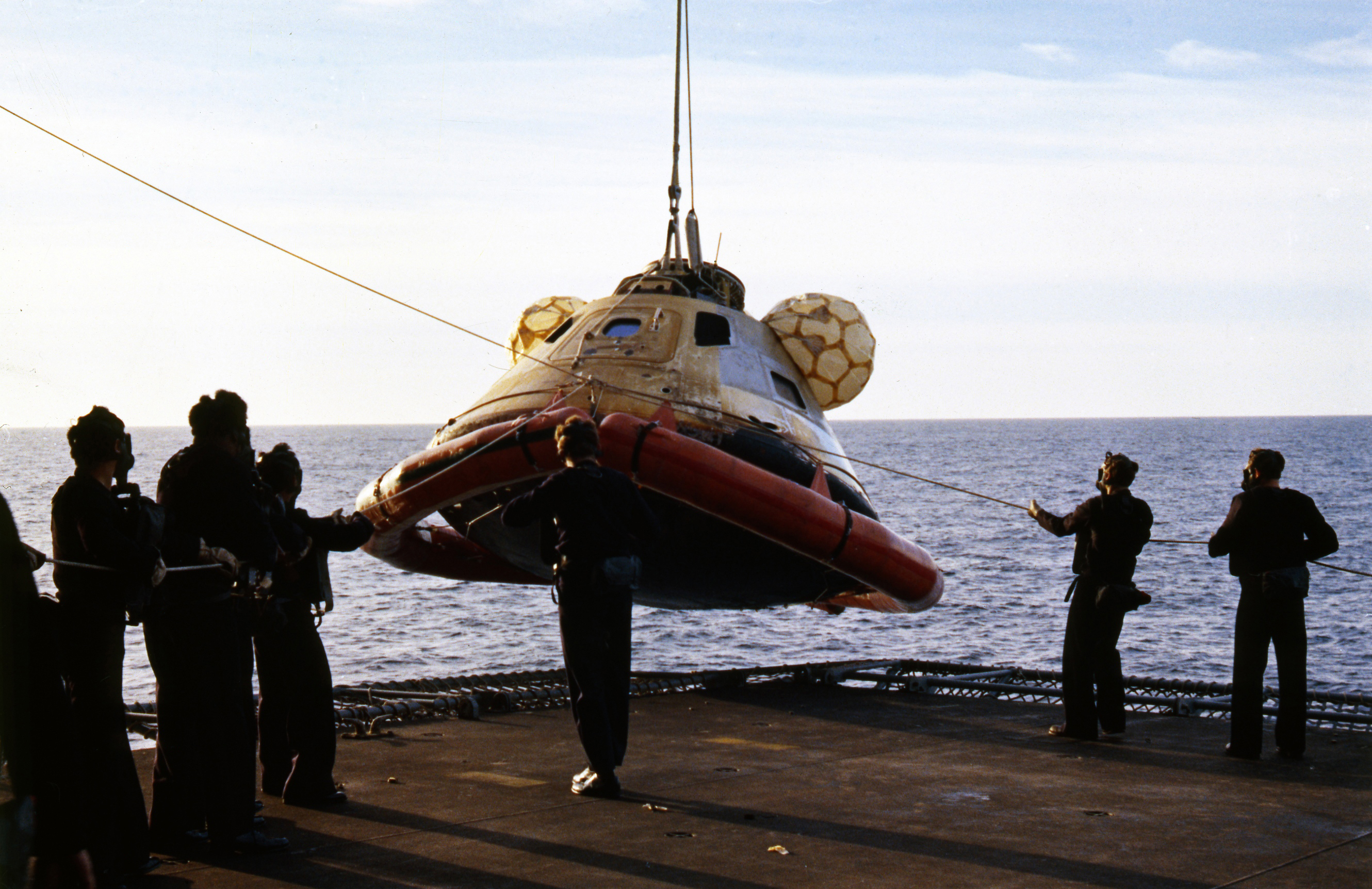 Sailors lift the CM onto an elevator deck on the New Orleans